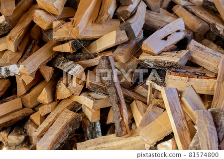 a pile of rustic birch firewood chunks 81574800