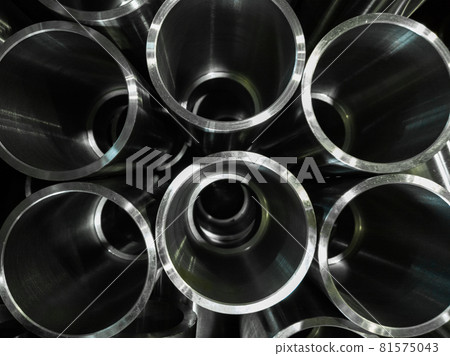dark industrial background with cnc machined shiny steel pipes - selective focus and lens blur tech dark industrial background with cnc machined shiny steel pipes - selective focus and lens blur tech 81575043