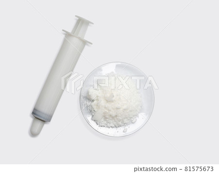 White syringe and sodium chloride, medical equipment on white laboratory table. 81575673
