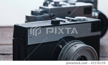 Old vintage 35 mm metal film camera, close-up Old vintage 35 mm metal film camera, close-up 81576159