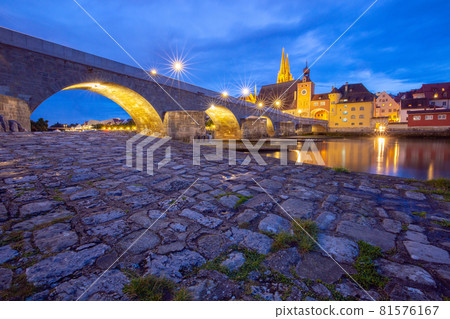 Regensburg. Old stone bridge over the Danube river at night light. Regensburg. Old stone bridge over the Danube river at night light. 81576167