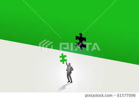 Businessman putting missing jigsaw puzzle piece 81577896