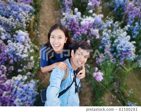 Lover selfie happy to travel in flower garden in Chiang Mai Thailand Lover selfie happy to travel in flower garden in Chiang Mai Thailand 81580281