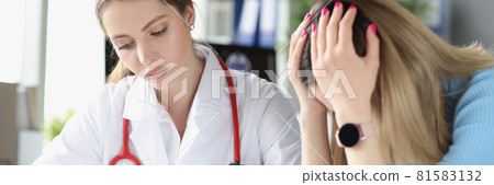 Sad woman holding her head at doctor appointment in clinic Sad woman holding her head at doctor appointment in clinic 81583132