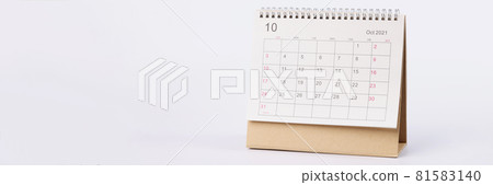 Page with dates of october is open on desk calendar closeup Page with dates of october is open on desk calendar closeup 81583140