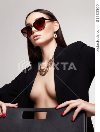 fashion portrait of Beautiful sexy woman in sunglasses and jewelry fashion portrait of Beautiful sexy woman in sunglasses and jewelry 81583500