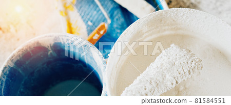 The concept of repair of the house and premises. Buckets of paint and lime for whitewashing and The concept of repair of the house and premises. Buckets of paint and lime for whitewashing and 81584551