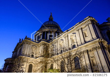 St. Paul's Cathedral in London, UK. Evening view of St Paul's taken from the southeast of the cathedral. Illuminated building and clear dark blue sky St. Paul's Cathedral in London, UK. Evening view of St Paul's taken from the southeast of the cathedral. Illuminated building and clear dark blue sky 81586175