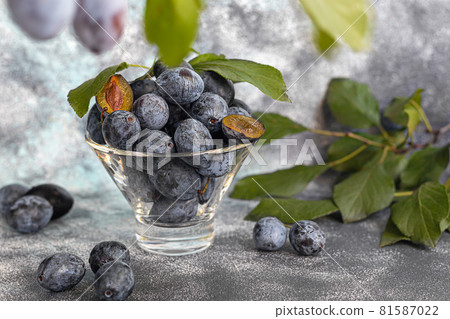 Plums on a light background. Harvesting the autumn harvest. Making jam and sauce. Still life. Plums on a light background. Harvesting the autumn harvest. Making jam and sauce. Still life. 81587022