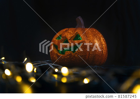 Halloween pumpkin Jack O Lanterns and bokeh lights on foreground with copy space. decoration for party - Halloween Background 81587245