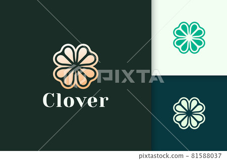 Clover leaf logo in luxury gold color represent lucky or herb 81588037