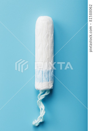 Hygienic tampon on a blue background with a free space 81588062
