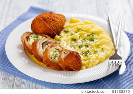 Chicken Kiev served with potato mash on a plate Chicken Kiev served with potato mash on a plate 81588870