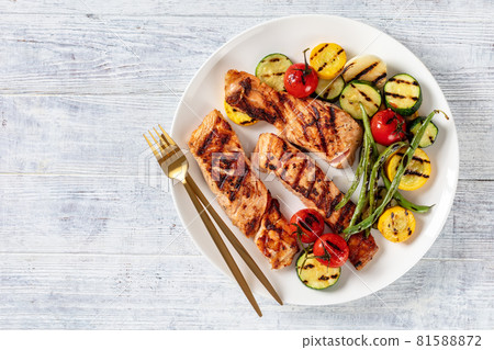 grilled salmon and vegetables on a plate grilled salmon and vegetables on a plate 81588872