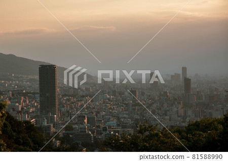 Skyscrapers in Kobe Sannomiya at dawn. Wrapped in the morning mist Skyscrapers in Kobe Sannomiya at dawn. Wrapped in the morning mist 81588990