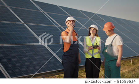 Technician and investor Using Infrared Drone Technology to Inspect Solar Panels and Wind Turbines in Solar cell Farm, Solar cells will be an important renewable energy of the future. Solar panel Technician and investor Using Infrared Drone Technology to Inspect Solar Panels and Wind Turbines in Solar cell Farm, Solar cells will be an important renewable energy of the future. Solar panel 81589634