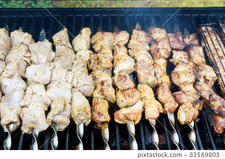 Barbecue grill on roast meat skewers over charcoal BBQ 81589803
