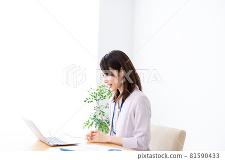 Young business woman doing office work in the office Young business woman doing office work in the office 81590433