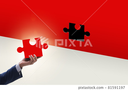 Businessman putting missing jigsaw puzzle piece Businessman putting missing jigsaw puzzle piece 81591197