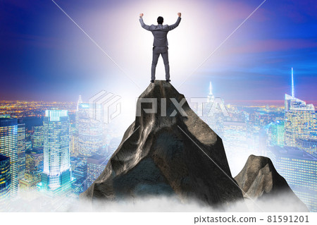 Businessman at the top of mountain in career concept Businessman at the top of mountain in career concept 81591201