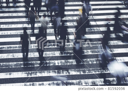 People crossing the pedestrian crossing Business image 81592036