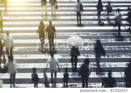 People crossing the pedestrian crossing Business image 81592037