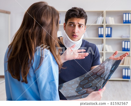 Man with neck injury visiting doctor for check-up 81592567