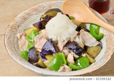 Stir-fried eggplant and peppers with pork, grated radish and ponzu sauce. 81594182