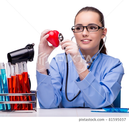 Young doctor with red heart isolated on white Young doctor with red heart isolated on white 81595037