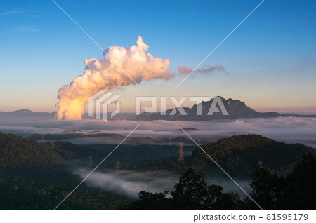 Sea of fog and coal-fired power plant. 81595179