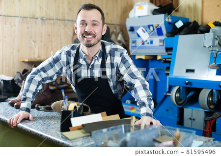 Happy man worker displaying his workplace 81595496