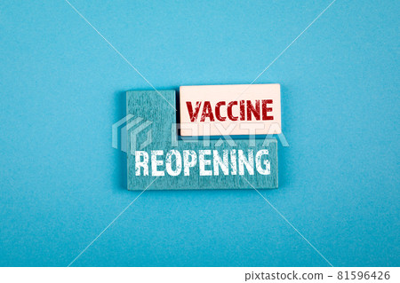 Reopening and Vaccine. Health and business concept. Wooden cubes with text on a blue background Reopening and Vaccine. Health and business concept. Wooden cubes with text on a blue background 81596426