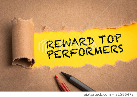 Reward top performers. Torn cardboard on a yellow background 81596472