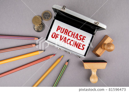 Purchase of Vaccines. Business cards, colored pencils and euro money on a gray office desk Purchase of Vaccines. Business cards, colored pencils and euro money on a gray office desk 81596473