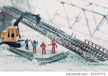 A diorama landscape of a railway bridge that collapsed due to a disaster and restoration 81597473