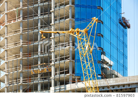 Facade repair and wall insulation with mineral insulation in a modern residential building using a winch and a mobile platform. Facade repair and wall insulation with mineral insulation in a modern residential building using a winch and a mobile platform. 81597903