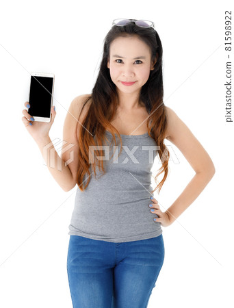 Cheerful Asian female presenting smartphone 81598922