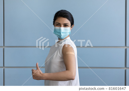 Happy young indian woman feeling good after vaccination. Happy young indian woman feeling good after vaccination. 81601647