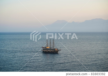 Seascape with a lonely ship in the Mediterranean. Boat trip on a tourist ship. Sights and travels of Turkey. Seascape with a lonely ship in the Mediterranean. Boat trip on a tourist ship. Sights and travels of Turkey. 81603392