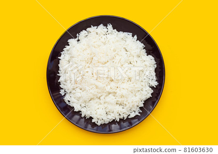Dish of rice on yellow background. Dish of rice on yellow background. 81603630