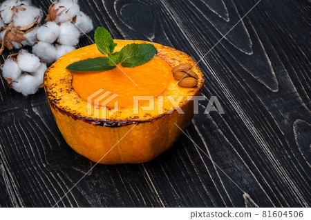 Healthy natural food, pumpkin cream soup on a black wooden background 81604506