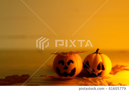 Halloween pumpkins with painted faces on a wooden table. Halloween background. Space for text. copy space. Halloween pumpkins with painted faces on a wooden table. Halloween background. Space for text. copy space. 81605779