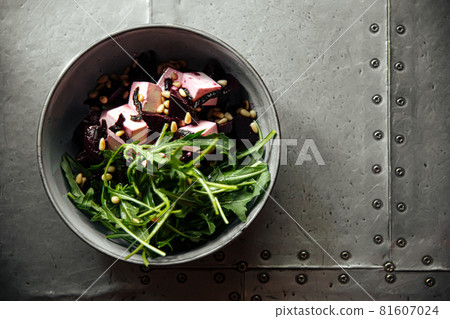 Beet root salad bowl with arugula and cheese Beet root salad bowl with arugula and cheese 81607024