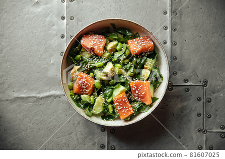Healthy salmon bowl with avocado and edamame beans Healthy salmon bowl with avocado and edamame beans 81607025