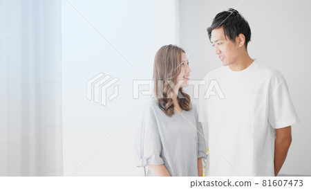 Women and men standing side by side Women and men standing side by side 81607473