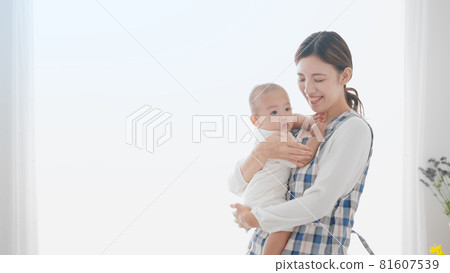 Child nurse holding a baby Child nurse holding a baby 81607539