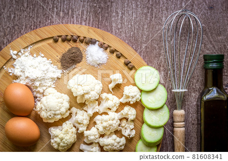Fresh vegetables ready for roast. Top view. Wooden background 81608341