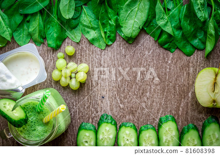 Green smoothie with apples, yogurt, spinach, cucumber on wooden background Green smoothie with apples, yogurt, spinach, cucumber on wooden background 81608398