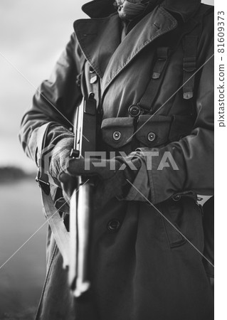 Soldier Of USA Infantry Of World War II Holds Submachine Weapon In Hands. black and white photography Soldier Of USA Infantry Of World War II Holds Submachine Weapon In Hands. black and white photography 81609373