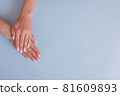 Beautiful woman manicure on creative trendy blue background. 81609893